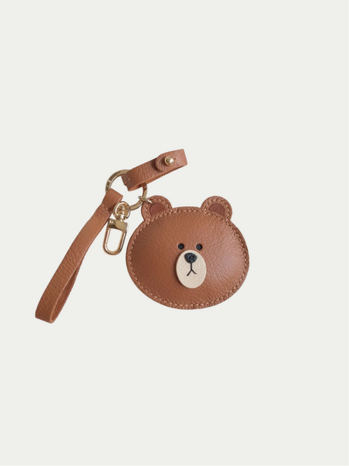 Handmade brown bear bag charm made from soft French lambskin leather on a white background

