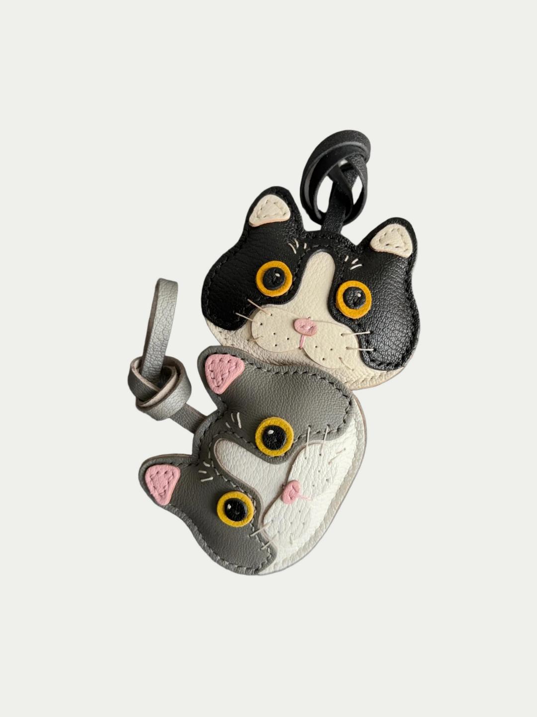 Close up of Rainbow Zoo Cat Charm showing meticulous stitching and soft leather texture