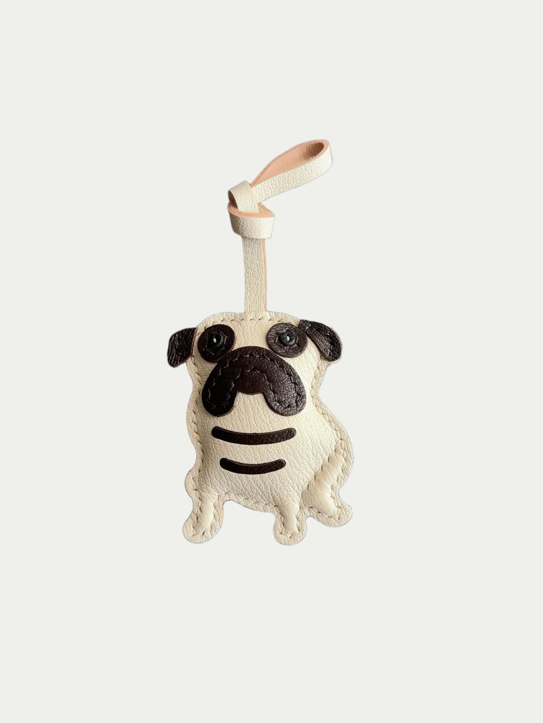 french Handmade Sheepskin Pug Bag Charm  Dog Lover Gift
French Handmade Sheepskin Pug Bag Charm
Artisanal French Lambskin Pug Purse Hanger
Luxury French Sheepskin Pug Bag Pendant 
Hand-stitched French Lambskin Pug Bag Charm for Dog Owners