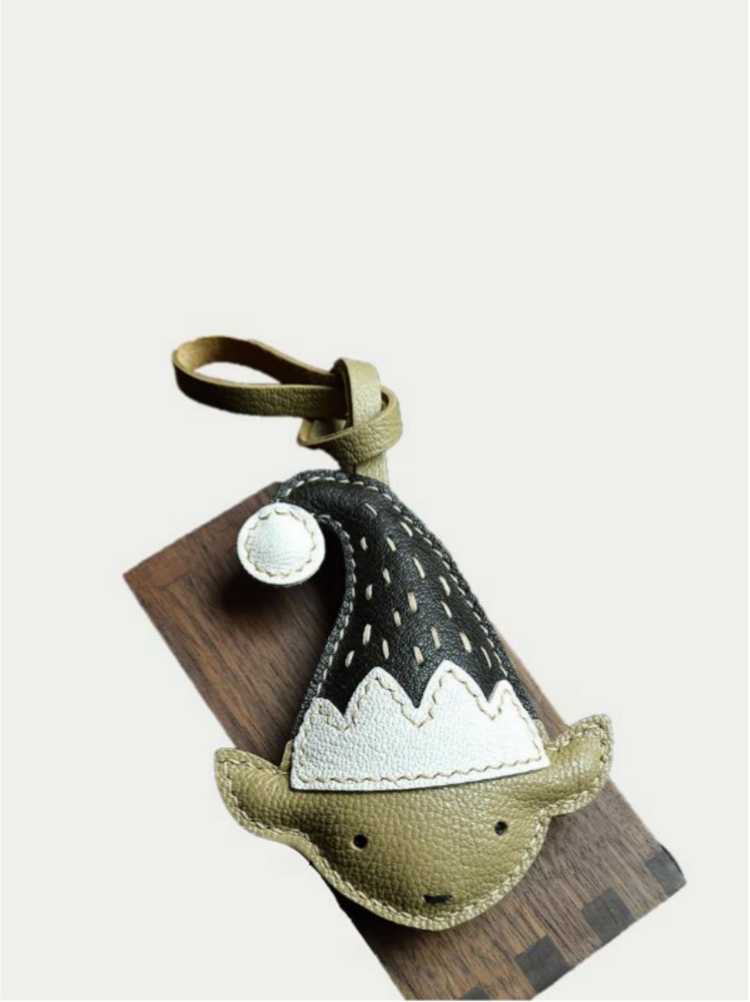 Miniature elf bag charm with detailed stitching