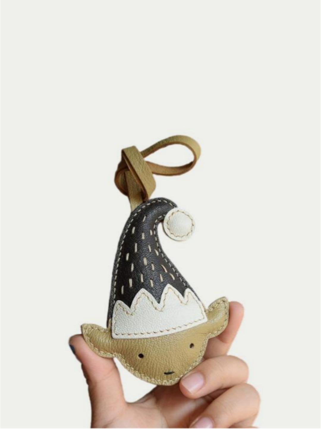 Miniature elf bag charm with detailed stitching